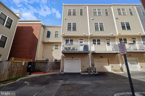 a front view of a residential apartment building with a garage