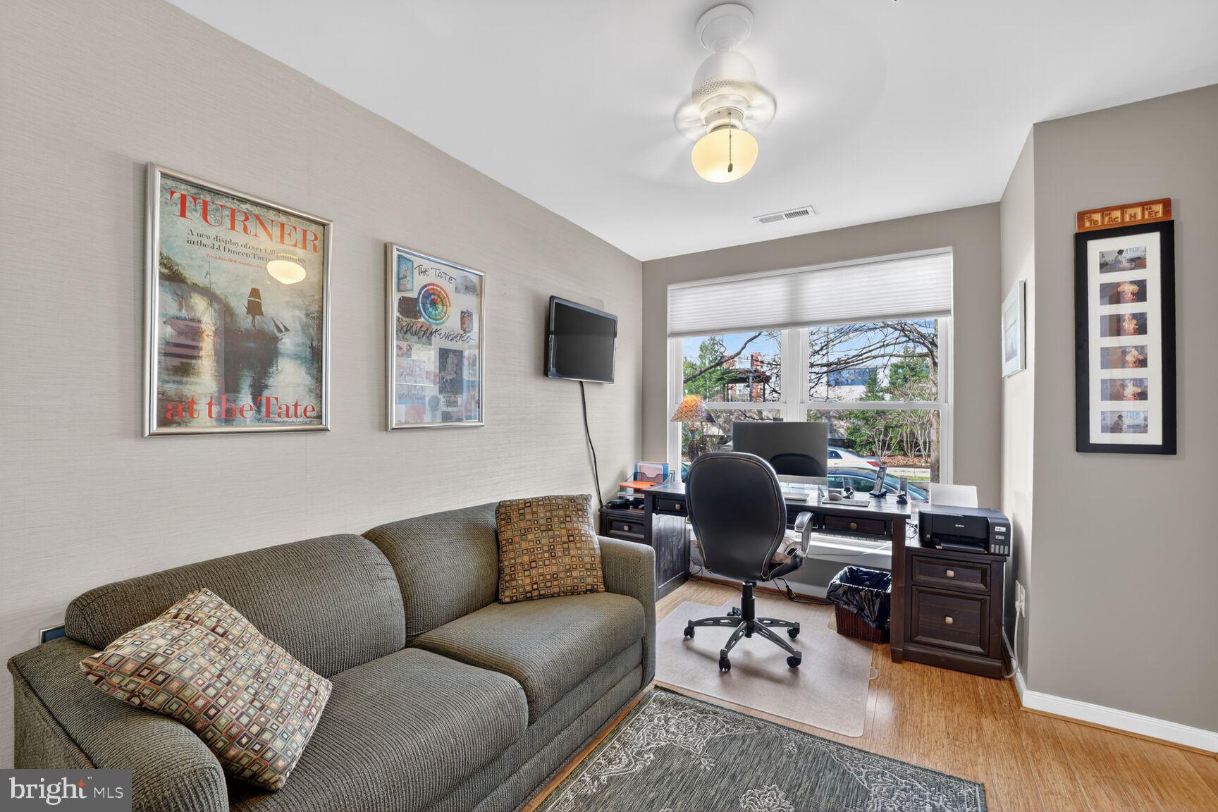 814 3rd Street Southeast Washington, DC 20003 - Photo 4 of 36 a living room with furniture and a window