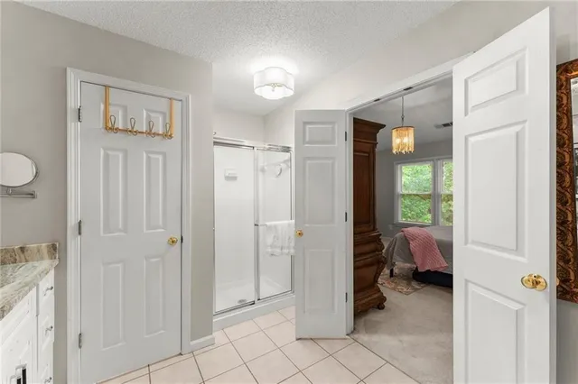 a view of a room that has a bed and a window in closet