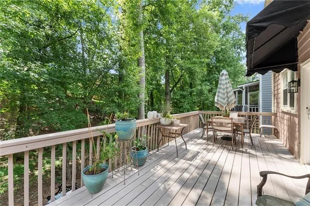 a view of balcony with furniture and trees
