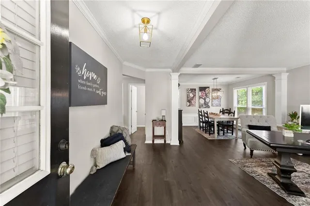 a living room with furniture and a table