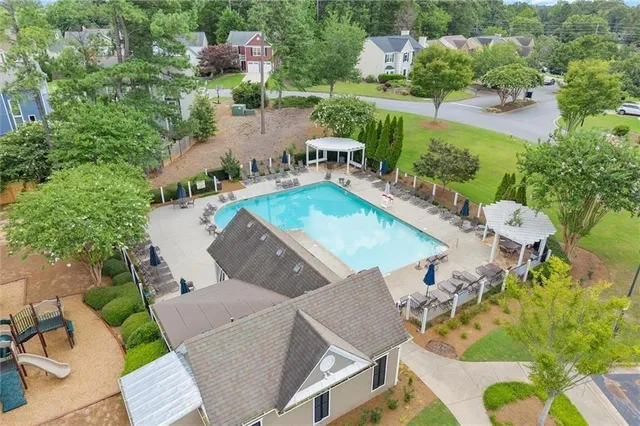 an aerial view of a house with outdoor space