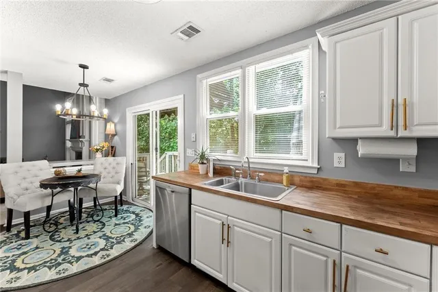 a kitchen with sink cabinets and window
