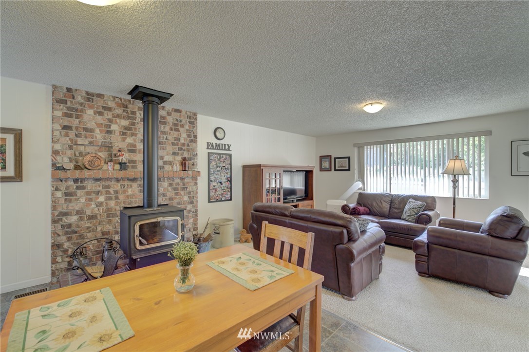 19225 Southeast 141st Street Renton, WA 98059 - Photo 14 of 25 a view of a livingroom with furniture window and wooden floor