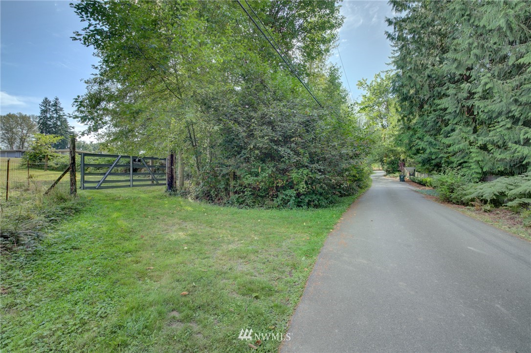 19225 Southeast 141st Street Renton, WA 98059 - Photo 3 of 25 a view of a park with large trees