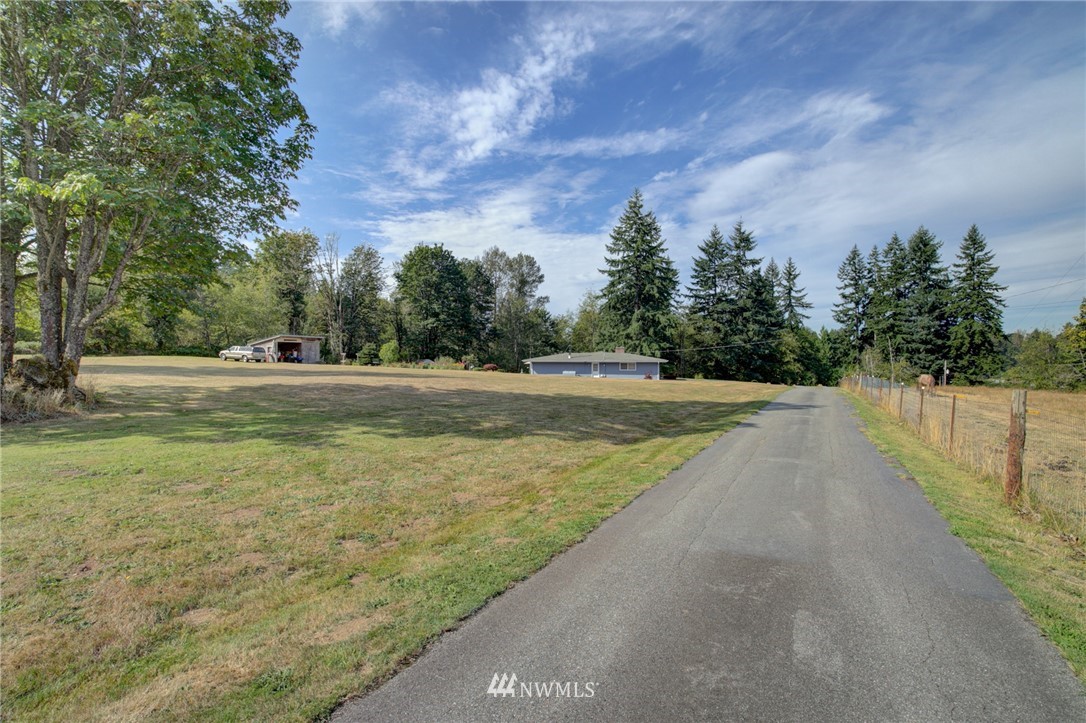 19225 Southeast 141st Street Renton, WA 98059 - Photo 5 of 25 a view of a swimming pool with a yard