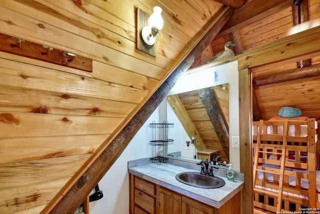 a bathroom with a sink and mirror