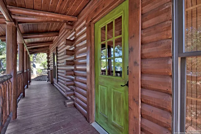 a view of a house with a green gate