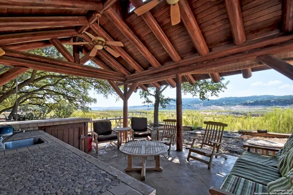 a view of a chairs and table in the balcony