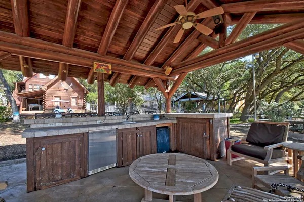 a view of a porch with furniture and a fire pit