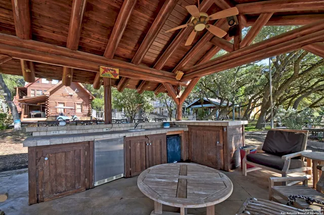 a view of a porch with furniture and a fire pit