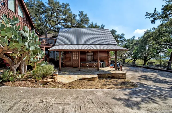 a backyard of a house with yard barbeque oven and outdoor seating