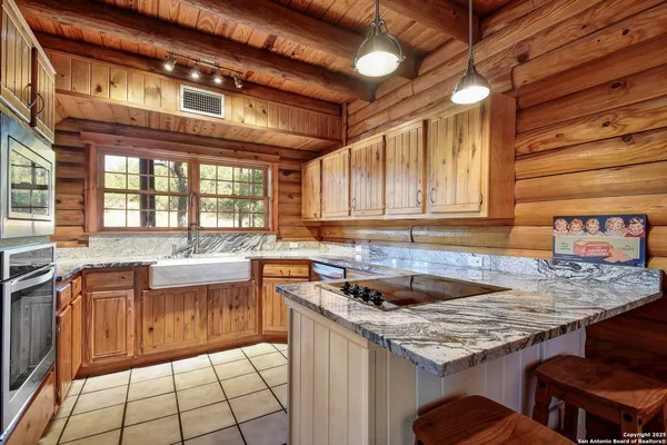 a kitchen with a sink and cabinets