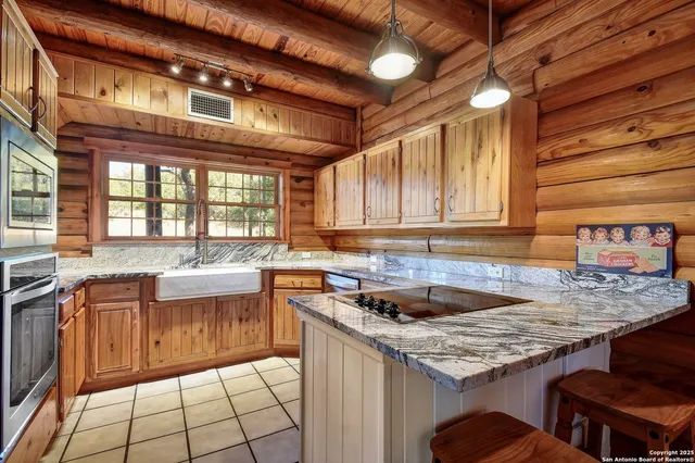 a kitchen with a sink and cabinets