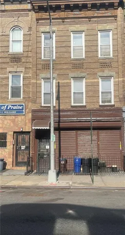 a street sign on a brick building