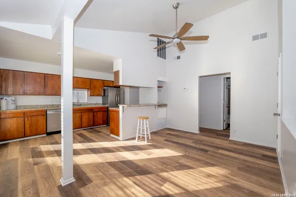a view of a kitchen with wooden floor