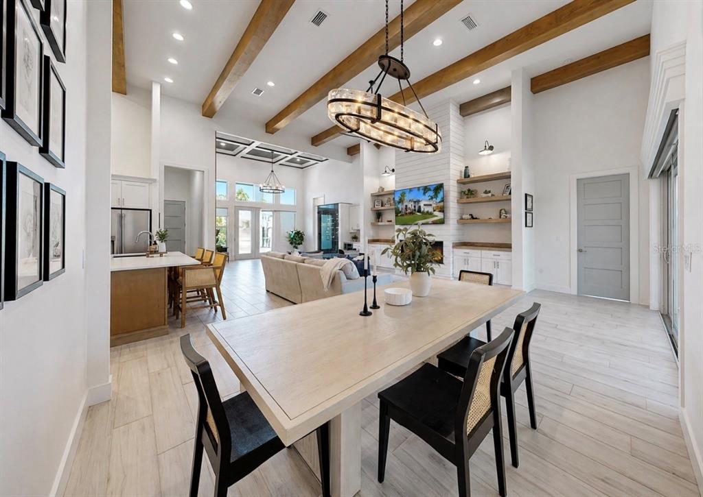 5605 Seagrass Place Apollo Beach, FL 33572 - Photo 26 of 86 a view of a dining area with furniture and a chandelier