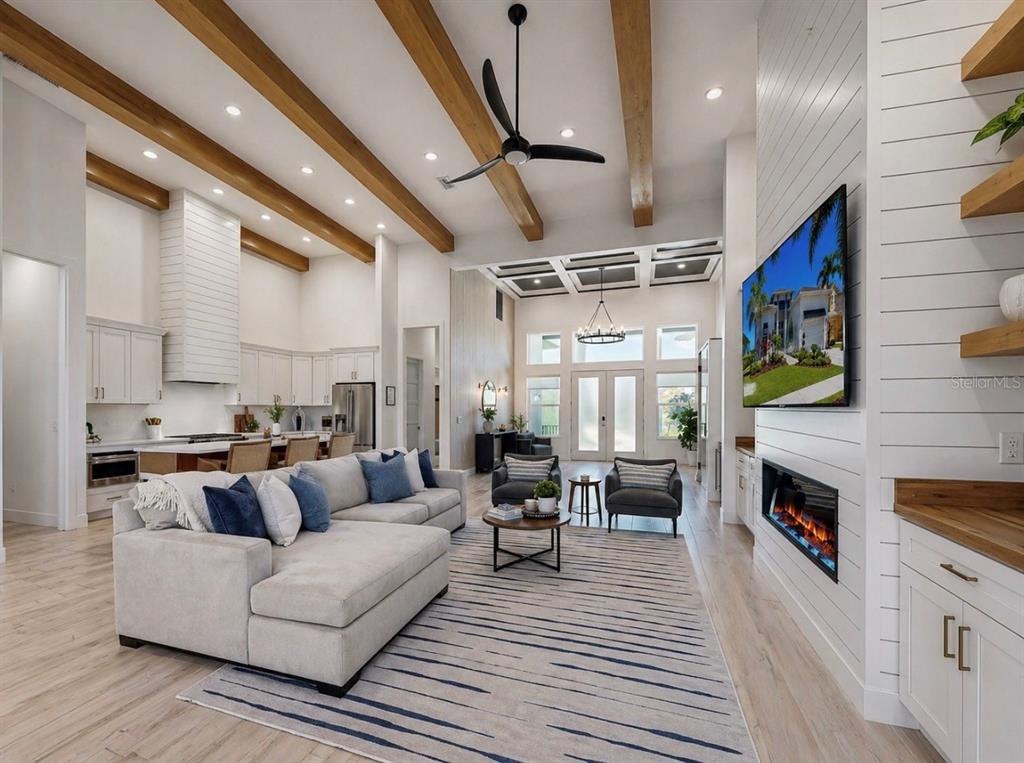 5605 Seagrass Place Apollo Beach, FL 33572 - Photo 28 of 86 a living room with furniture and a fireplace