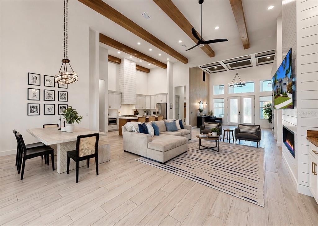 5605 Seagrass Place Apollo Beach, FL 33572 - Photo 29 of 86 a living room with furniture a fireplace and a table