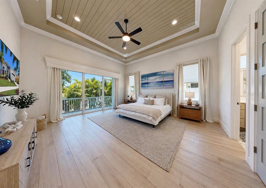5605 Seagrass Place Apollo Beach, FL 33572 - Photo 32 of 86 a bedroom with furniture and a large window