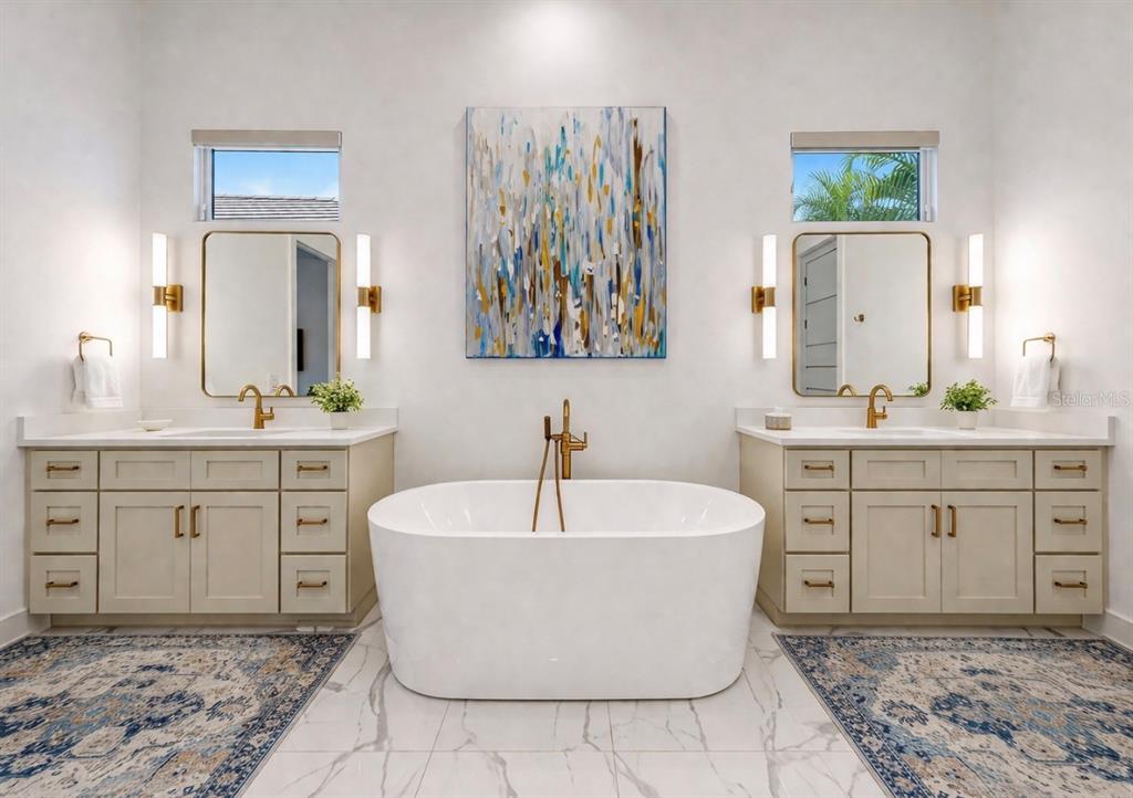5605 Seagrass Place Apollo Beach, FL 33572 - Photo 37 of 86 a spacious bathroom with a double vanity sink mirror and bathtub