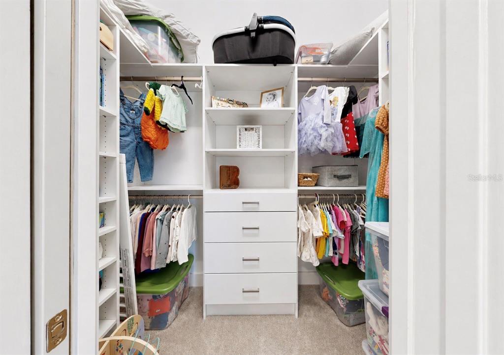 5605 Seagrass Place Apollo Beach, FL 33572 - Photo 45 of 86 a view of walk in closet with clothes and shoes