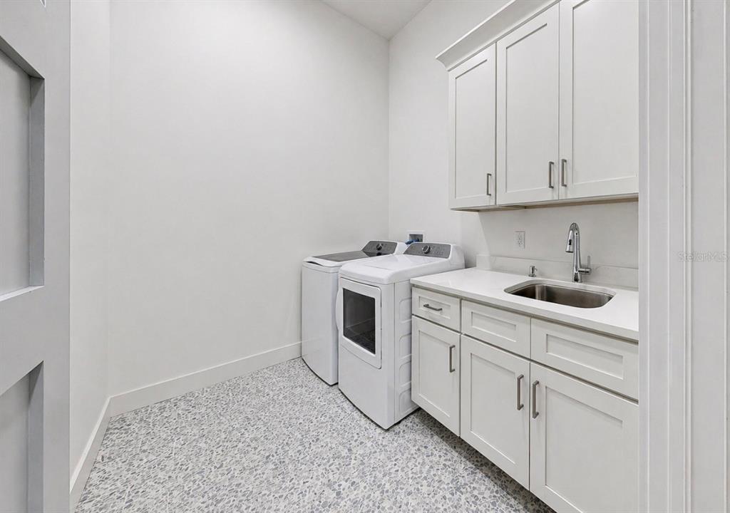 5605 Seagrass Place Apollo Beach, FL 33572 - Photo 49 of 86 a utility room with sink dryer and washer