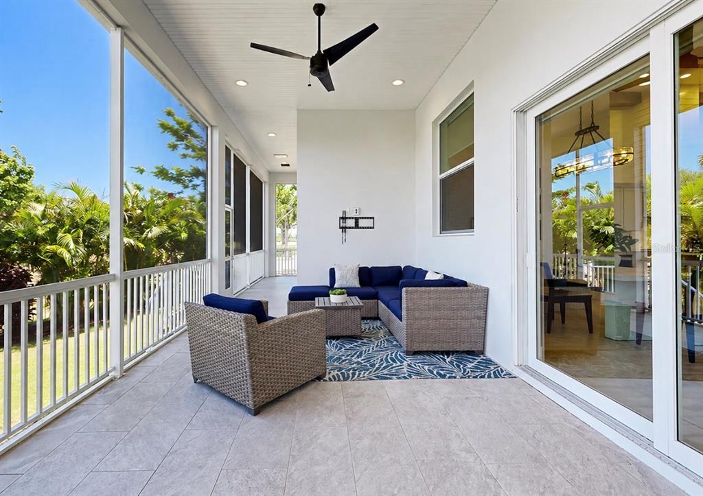 5605 Seagrass Place Apollo Beach, FL 33572 - Photo 54 of 86 a living room with furniture and a flat screen tv