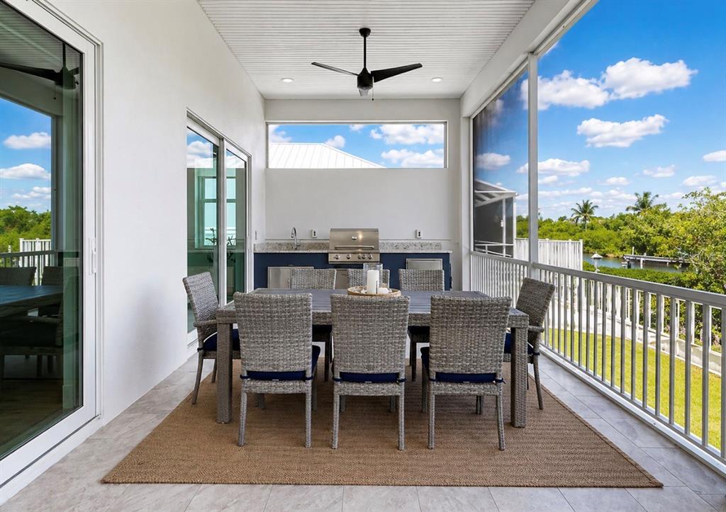 5605 Seagrass Place Apollo Beach, FL 33572 - Photo 56 of 86 a dining room with furniture window and wooden floor