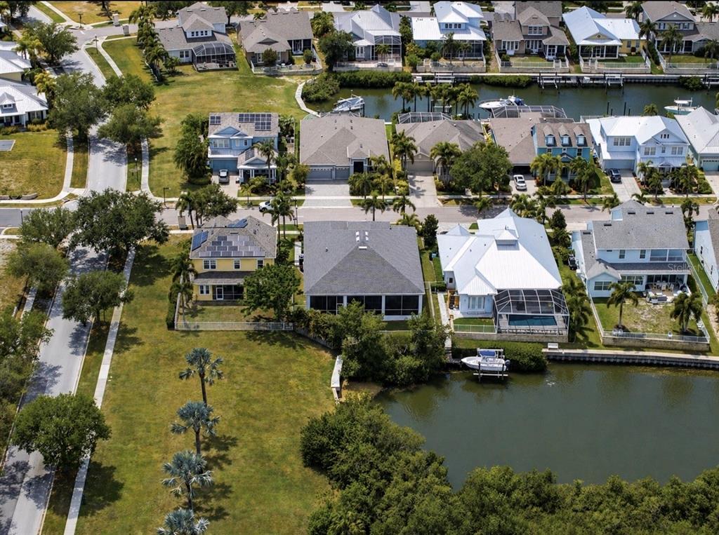 5605 Seagrass Place Apollo Beach, FL 33572 - Photo 70 of 86 an aerial view of residential houses with outdoor space and lake view