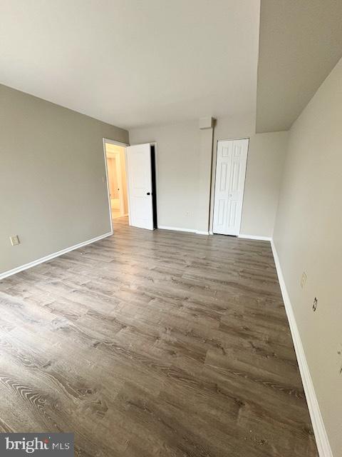 2109 Greenery Lane, Unit 30224 Silver Spring, MD 20906 - Photo 12 of 17 a view of an empty room with wooden floor