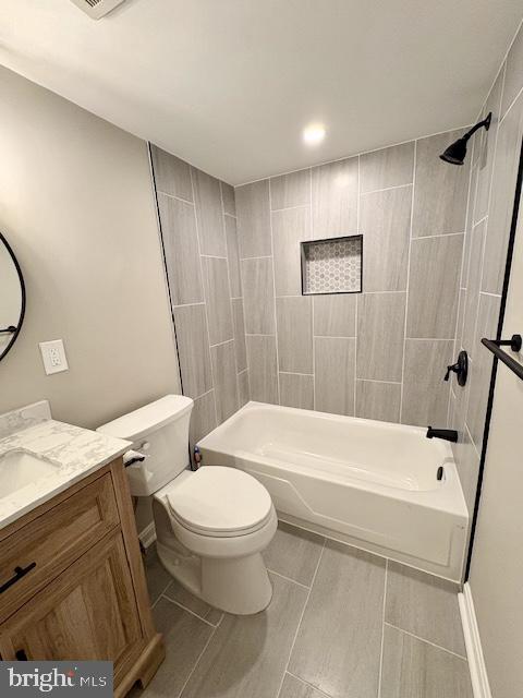 2109 Greenery Lane, Unit 30224 Silver Spring, MD 20906 - Photo 15 of 17 a bathroom with a toilet and a tub