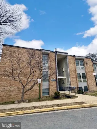 a brick building with a street view