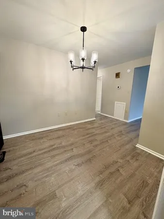 a view of a livingroom with wooden floor