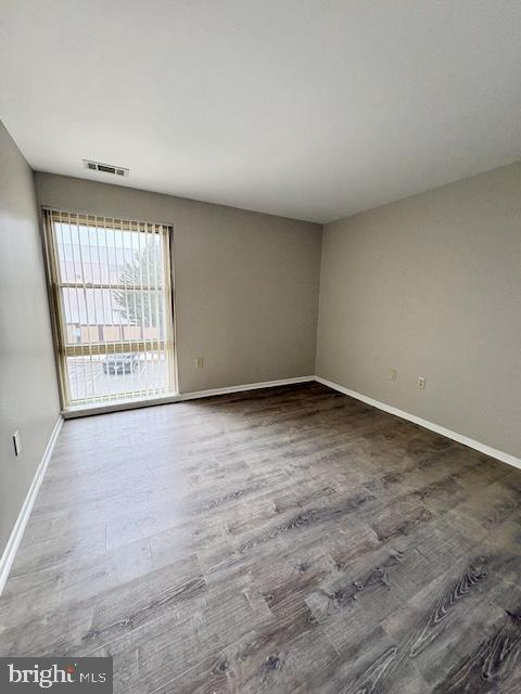 2109 Greenery Lane, Unit 30224 Silver Spring, MD 20906 - Photo 9 of 17 an empty room with windows