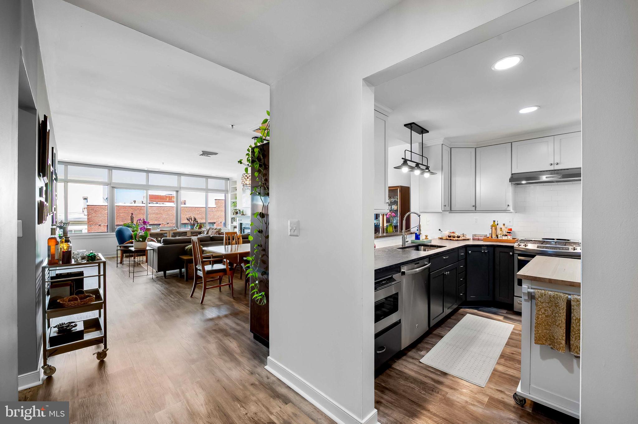 2901 Boston Street, Unit 513 Baltimore, MD 21224 - Photo 13 of 62 a kitchen with lots of counter top space and dining table
