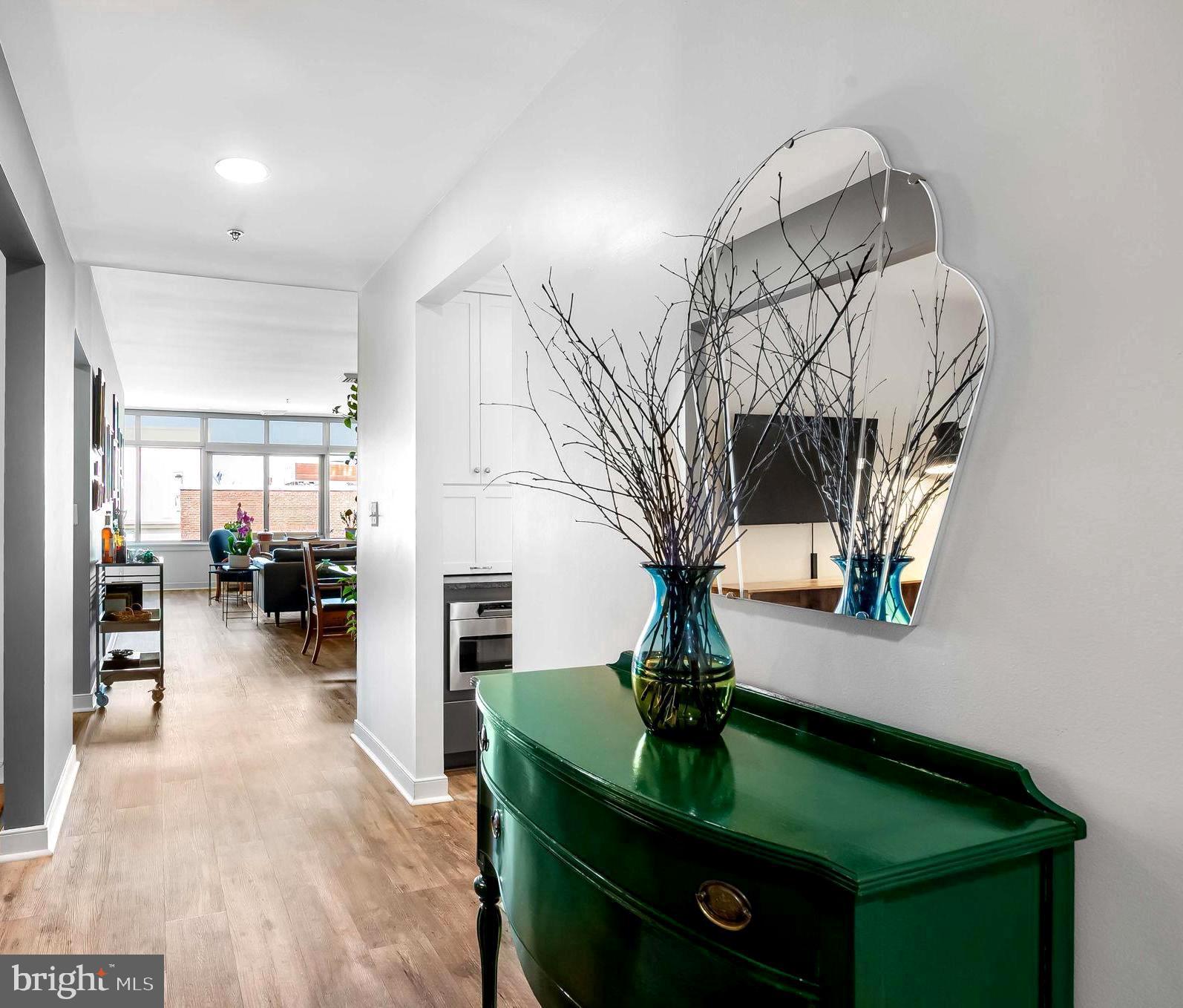 2901 Boston Street, Unit 513 Baltimore, MD 21224 - Photo 3 of 62 a view of living room kitchen with furniture and wooden floor