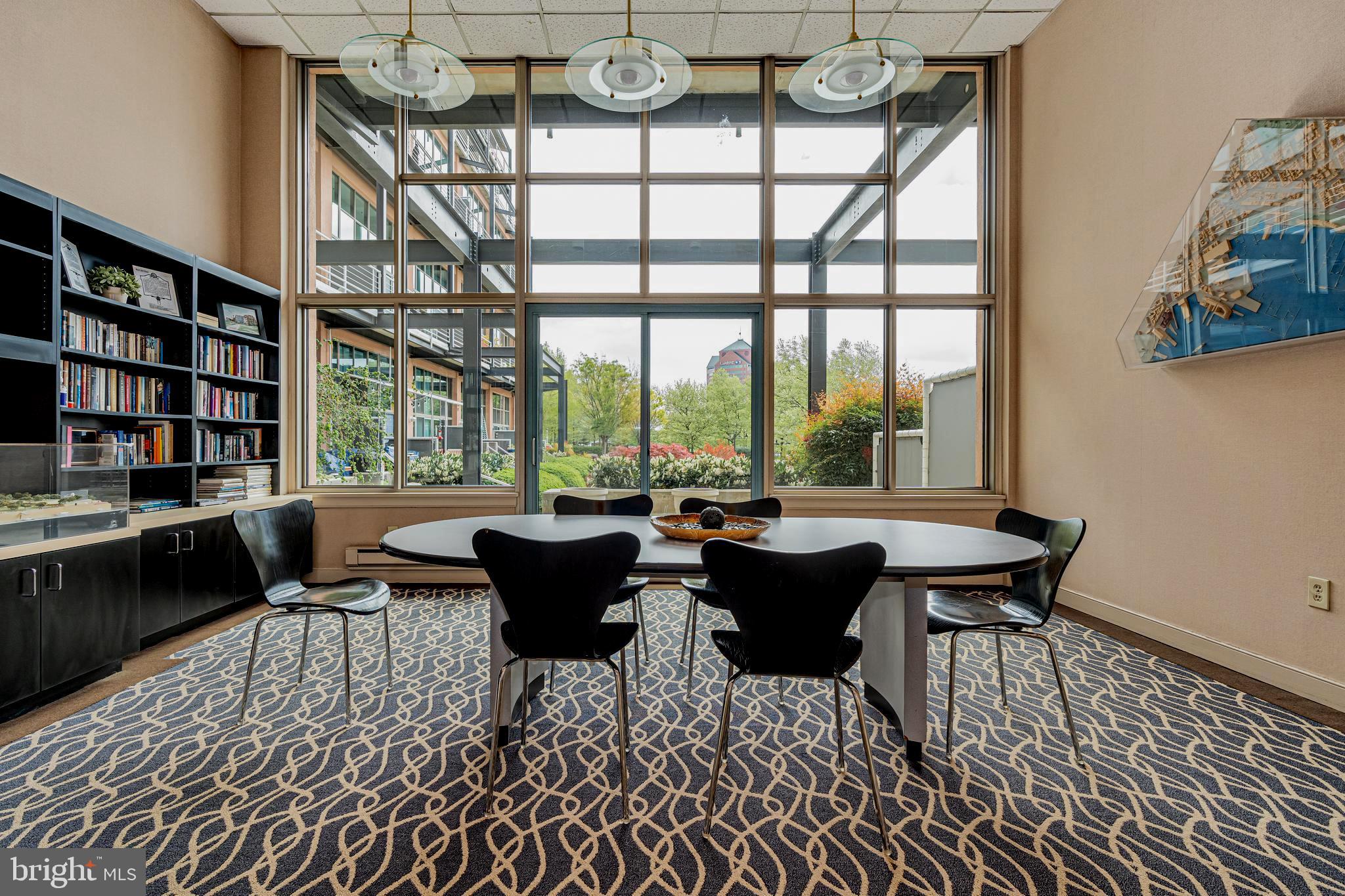 2901 Boston Street, Unit 513 Baltimore, MD 21224 - Photo 40 of 62 a living room with furniture a rug and a large window