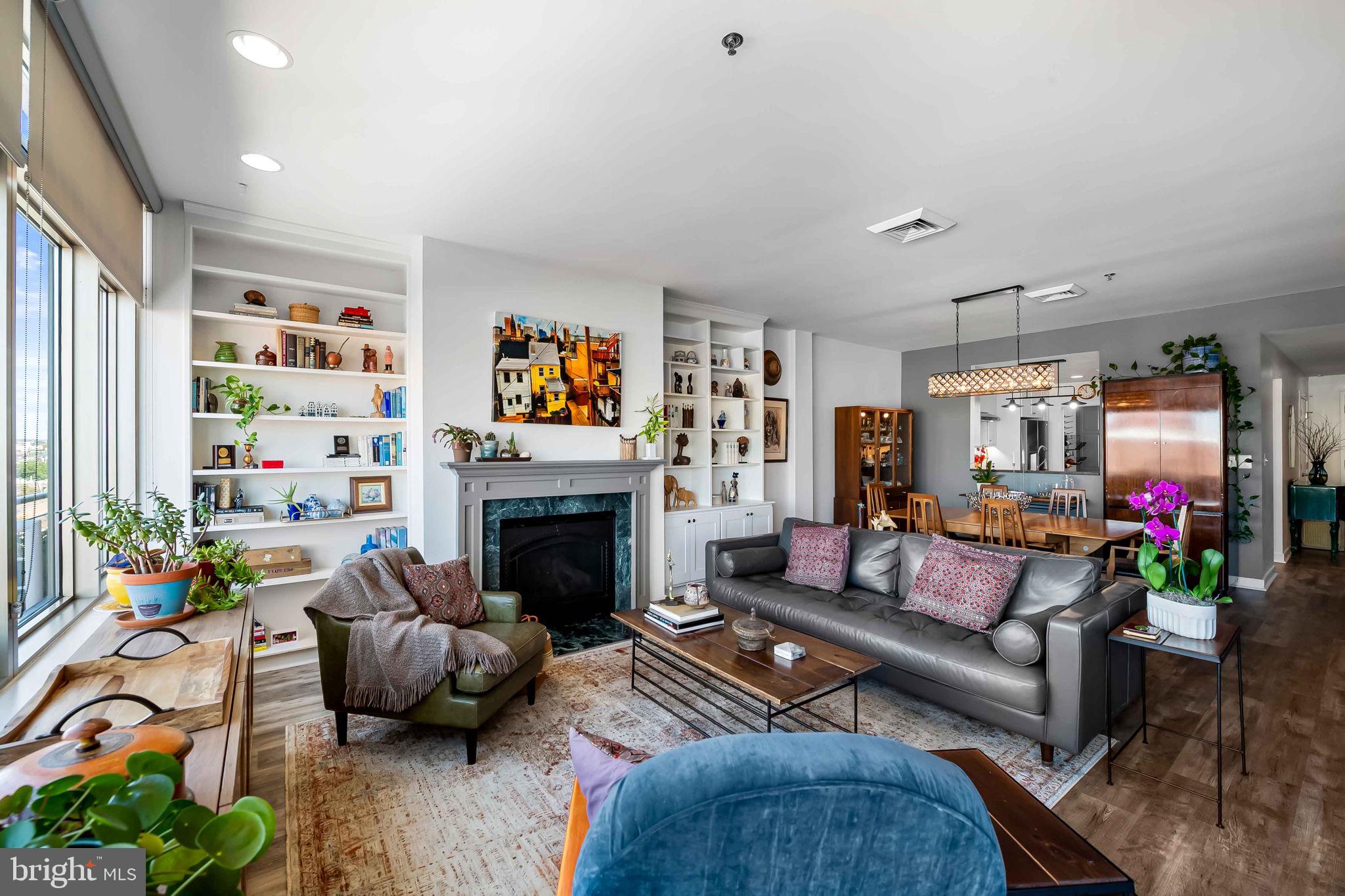 2901 Boston Street, Unit 513 Baltimore, MD 21224 - Photo 4 of 62 a living room with furniture and a fireplace