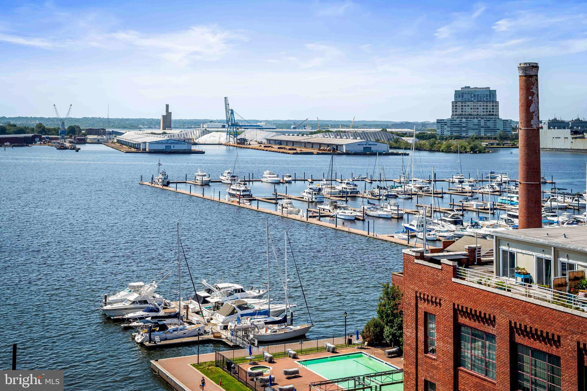 2901 Boston Street, Unit 513 Baltimore, MD 21224 - Photo 46 of 62 a view of a terrace with lawn chairs