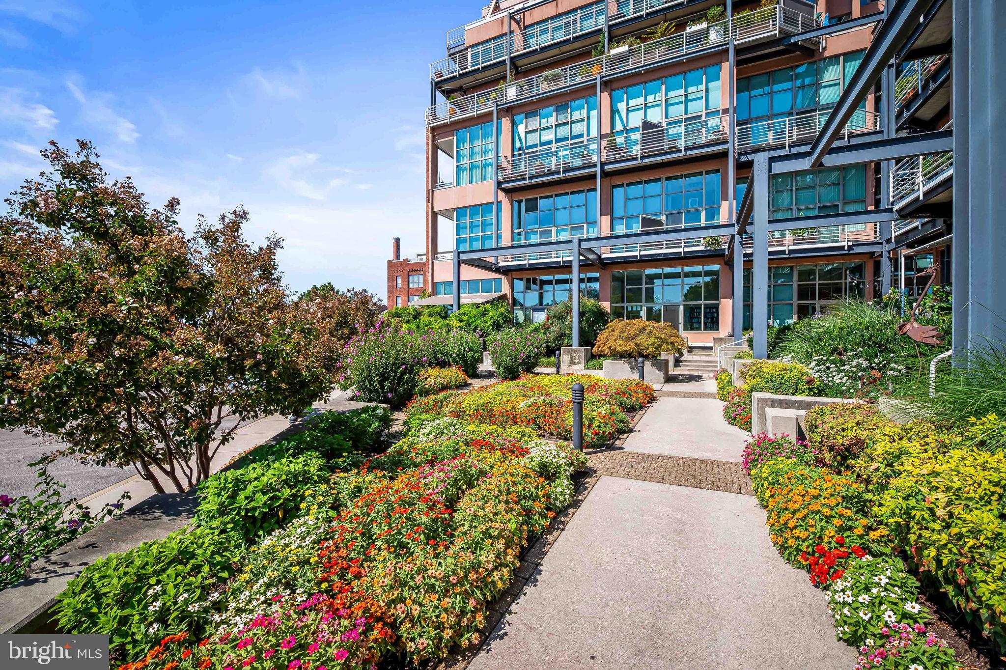 2901 Boston Street, Unit 513 Baltimore, MD 21224 - Photo 53 of 62 a view of a building with garden