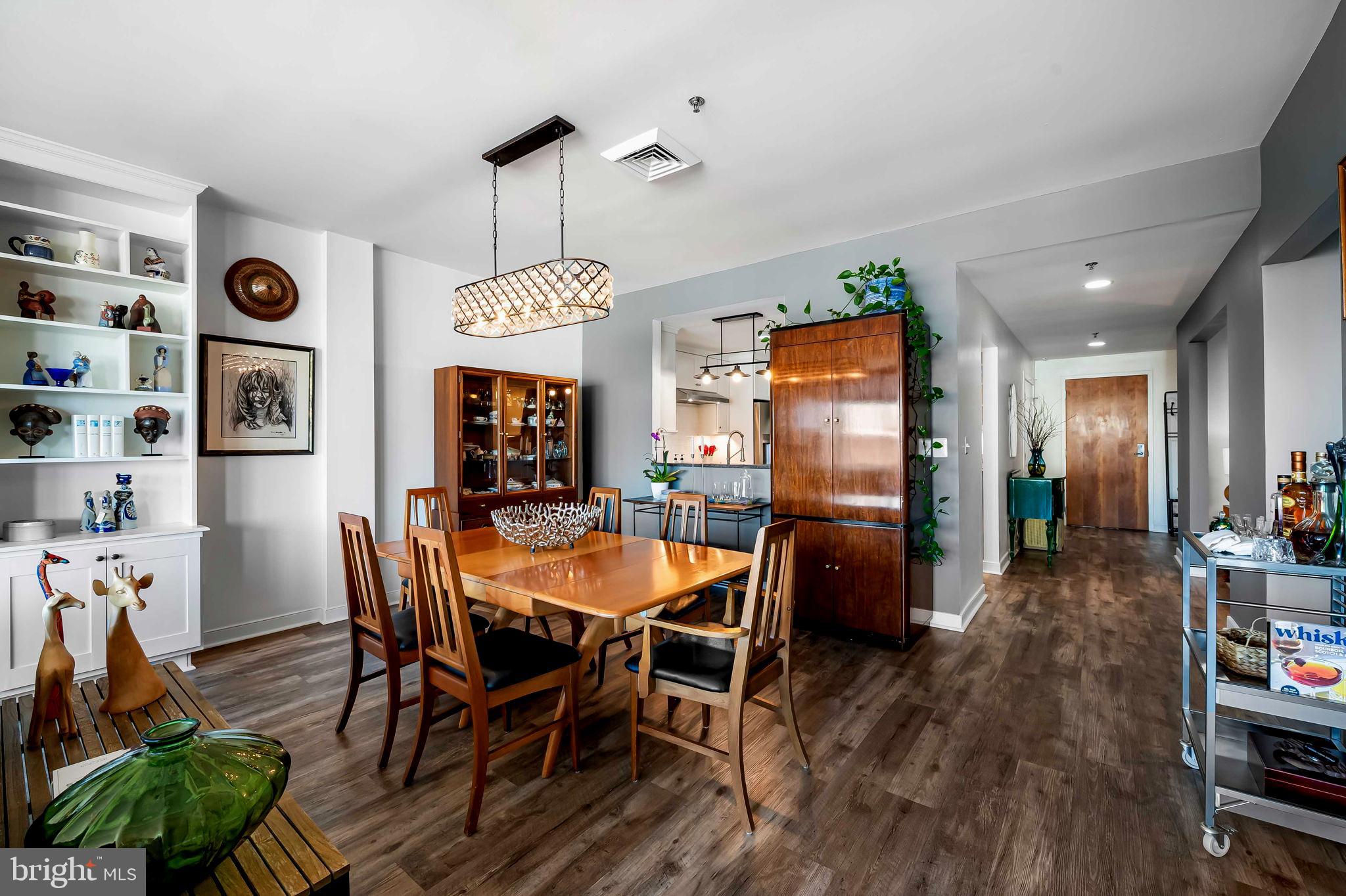 2901 Boston Street, Unit 513 Baltimore, MD 21224 - Photo 8 of 62 a dining room with furniture window and wooden floor