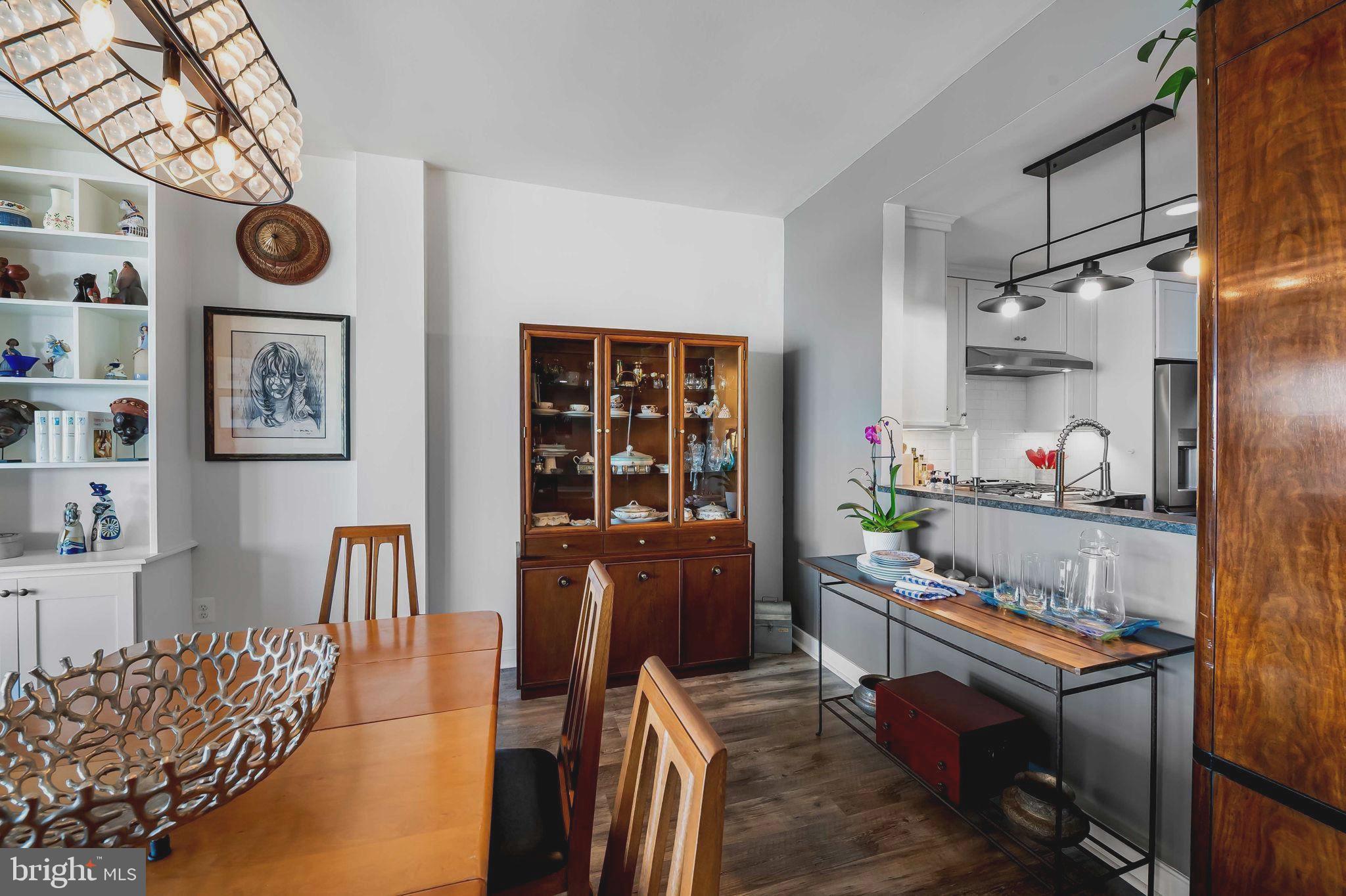 2901 Boston Street, Unit 513 Baltimore, MD 21224 - Photo 9 of 62 a living room with furniture and a table