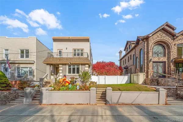 a front view of a house with a garden
