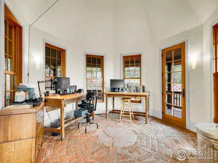 a living room with furniture a piano and a window