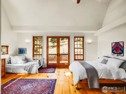 a spacious bedroom with a bed and a couch