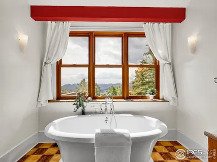 a white bath tub sitting next to a white sink