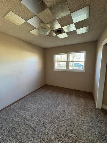 a view of an empty room and window