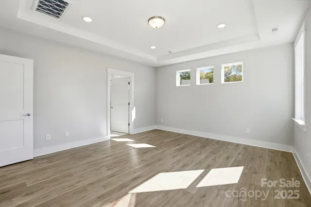 a spacious bathroom with a sink and a mirror