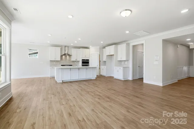 a view of kitchen with wooden floor